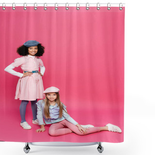 Personality  Happy African American Girl Posing With Hands On Hips Near Friend Sitting On Pink Shower Curtains