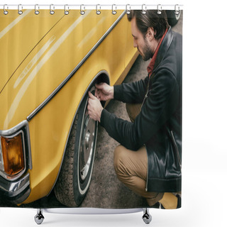 Personality  Cropped Shot Of Handsome Man In Leather Jacket Fixing Wheel Of Yellow Retro Car  Shower Curtains