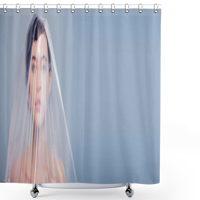 Personality  panoramic shot of model covered with polyethylene looking at camera isolated on grey, ecology concept shower curtains