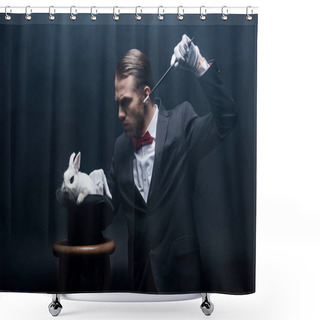 Personality  Concentrated Magician In Suit Showing Trick With Wand And White Rabbit In Hat, Dark Room With Smoke Shower Curtains