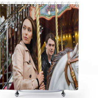 Personality  Pretty Woman In Trench Coat Riding Carousel Horse Near Blurred Boyfriend In Amusement Park Shower Curtains
