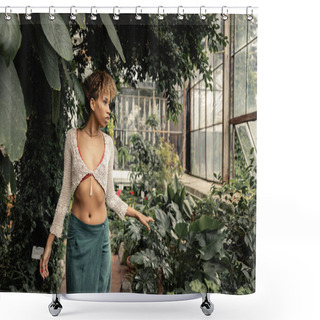 Personality  Fashionable Young African American Woman In Summer Skirt And Knitted Top Touching Plant And Looking Away While Standing In Blurred Greenhouse At Background, Stylish Lady Surrounded By Lush Greenery Shower Curtains