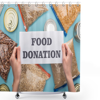 Personality  Cropped View Of Woman Holding Card With Food Donation Lettering Near Cans And Groats In Zipper Bags On Blue Background Shower Curtains