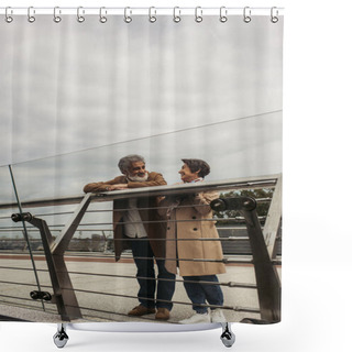 Personality  Cheerful Senior Man In Coat Looking At Pleased Wife While Leaning On Guard Rail Of Bridge  Shower Curtains