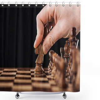 Personality  Cropped View Of Man Doing Move With Knight On Wooden Chessboard Isolated On Black Shower Curtains