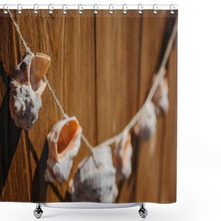 Personality  Sea Season. Necklace Made Of Black Sea Rapan Shells On A String On A Natural Wooden Background With A Background Blur. Background For A Marine Theme. Shower Curtains
