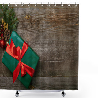 Personality  Top View Of Wrapped Green Present With Red Ribbon And Christmas Toys On Wooden Background Shower Curtains