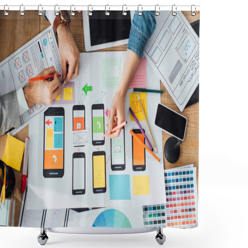 Personality  Top view of designers creative app interface for user experience design near layouts and digital devices on table shower curtains