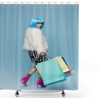 Personality  Stylish Asian Woman In Wig And Fluffy Jacket Holding Shopping Bags And Smiling At Camera On Blue Background  Shower Curtains