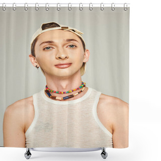 Personality  Portrait Of Young Gay Man With Blue Eyes Eyes Posing In Baseball Cap, White Tank Top And Colorful Beads On Grey Background, Pride Day Concept  Shower Curtains