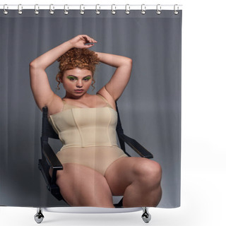 Personality  Sensual And Curvy Redhead Woman In Beige Underwear Sitting On Chair With Hands Above Head On Grey Shower Curtains