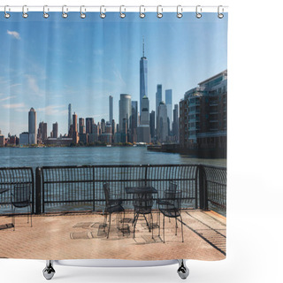 Personality  Embankment With Table And Chairs Near Harbor And Cityscape Of Manhattan In New York City Shower Curtains
