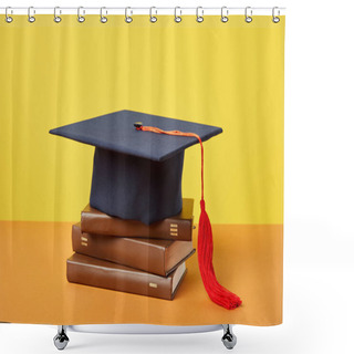 Personality  Academic Cap And Brown Books On Orange Surface Isolated On Yellow Shower Curtains