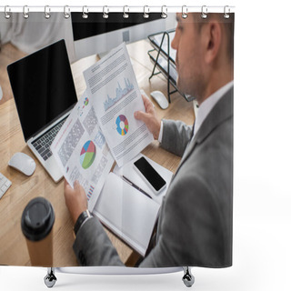 Personality  Partial View Of Trader Holding Papers With Infographics Near Smartphone And Laptop With Blank Screen, Blurred Foreground Shower Curtains
