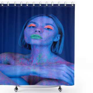 Personality  Portrait Of Young Woman In Bright Neon Makeup And Colorful Body Paint Looking At Camera Isolated On Dark Blue Shower Curtains