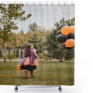 Personality  Cute Girl In Halloween Costume Holding Balloons And Candy Bucket While Walking On Green Grass Shower Curtains