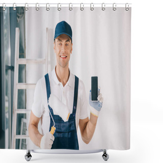 Personality  Handsome Young Painter In Uniform Holding Paint Roller And Showing Smartphone With Blank Screen Shower Curtains