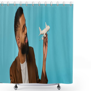 Personality  A Man Is Holding A Detailed Model Of A White Airplane, Showcasing Intricate Design And Craftsmanship. He Gazes Off, Lost In Thoughts Of Aviation And Adventure. Shower Curtains