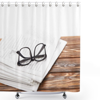 Personality  Eyeglasses On Pile Of Newspapers On Wooden Table, On White Shower Curtains