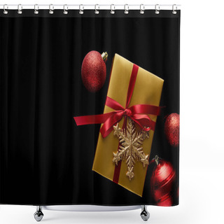 Personality  Top View Of Shiny Golden Christmas Gift With Red Ribbon And Snowflake Near Baubles Isolated On Black Shower Curtains