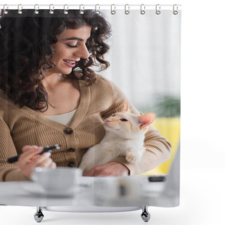 Personality  Smiling Copywriter Holding Marker And Looking At Oriental Cat Near Cup And Laptop At Home  Shower Curtains