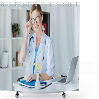 Personality  Smiling Adult Female Doctor Adjusting Eyeglasses At Table With Laptop In Office  Shower Curtains