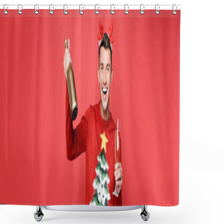 Personality  Cheerful Man In Christmas Sweater Holding Glass And Bottle Of Champagne Isolated On Red, Banner Shower Curtains