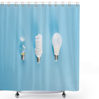 Personality  Top View Of Different Light Bulbs On Blue, Evolution Concept  Shower Curtains