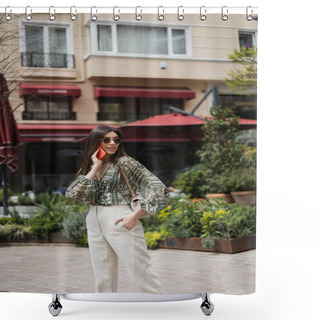 Personality  Young Woman With Long Hair And Sunglasses Smiling While Talking On Smartphone And Standing With Hand In Pocket And Handbag On Chain Strap Near Blurred Building And Plants In Istanbul  Shower Curtains