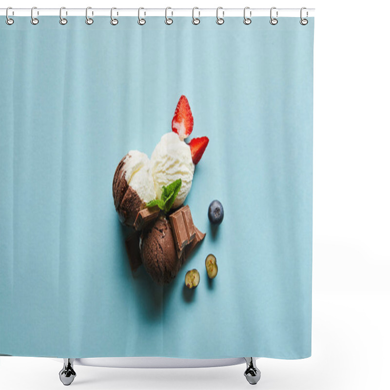 Personality  top view of tasty brown and white ice cream with berries, chocolate and mint on blue background shower curtains