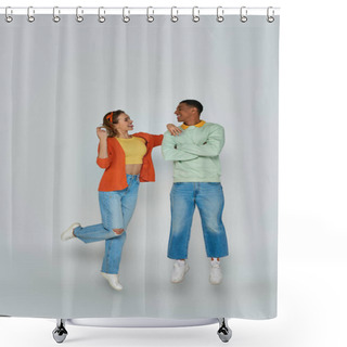 Personality  Happy Young Woman Sticking Out Tongue And Looking At African American Man On Grey Backdrop, Levitate Shower Curtains