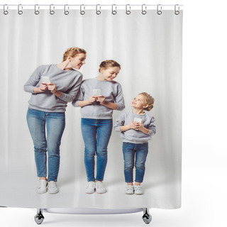 Personality  Smiling Mother And Daughters In Similar Clothing With Smartphones Isolated On Grey Shower Curtains