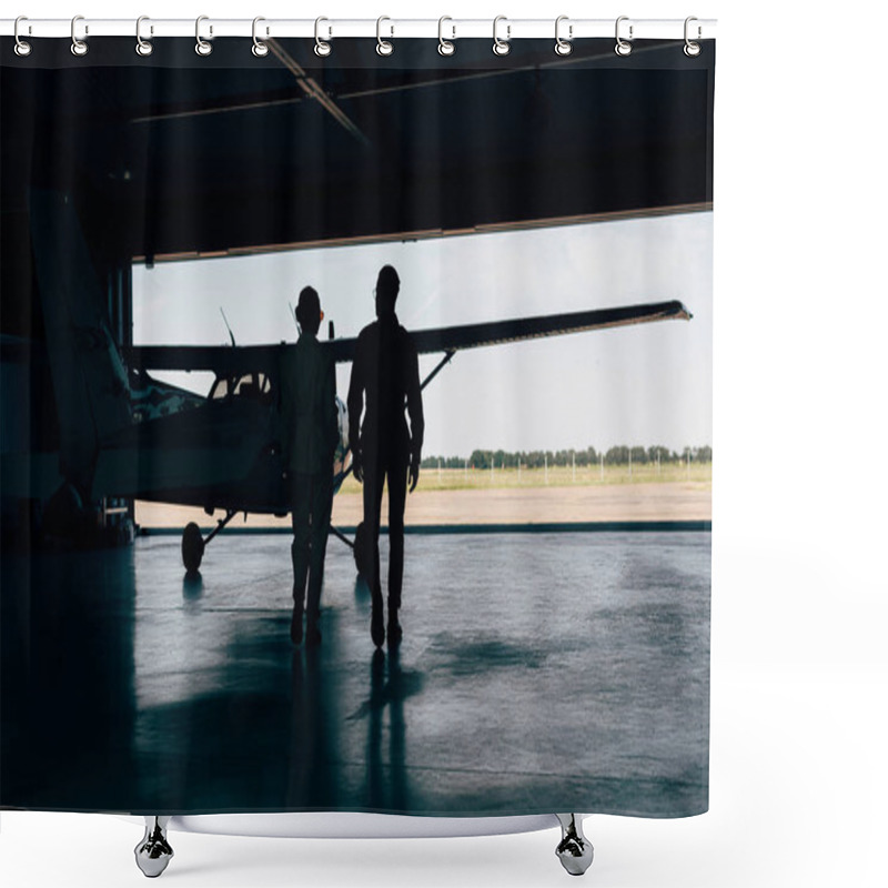 Personality  Rear View Of Silhouettes Of Stylish Couple Walking Near Airplane In Hangar  Shower Curtains
