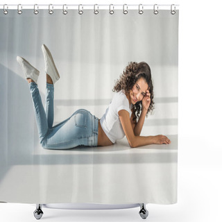 Personality  Beautiful Woman Lying On Floor In Tight Blue Jeans On Grey Background Shower Curtains