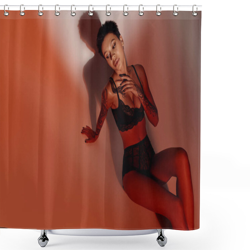 Personality  high angle view of sensual tattooed woman in black lace lingerie on red and brown background shower curtains