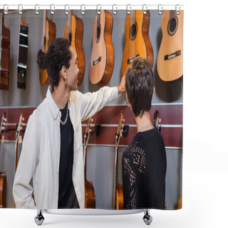 Personality  African American Seller Looking At Acoustic Guitars Near Customer In Music Store  Shower Curtains