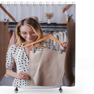 Personality  Joyful Fashion Designer Holding Hanger With Templates In Showroom On Blurred Foreground Shower Curtains
