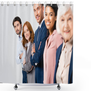Personality  Smiling Businesspeople With Crossed Arms Looking At Camera Near Multiethnic Colleagues On Blurred Foreground Isolated On Grey Shower Curtains
