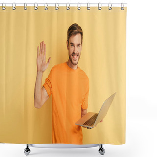 Personality  Happy Man Waving Hand At Camera While Holding Laptop On Yellow Background Shower Curtains
