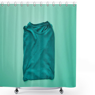 Personality  Top View Of Blank Color Folded T-shirt On Turquoise Background Shower Curtains