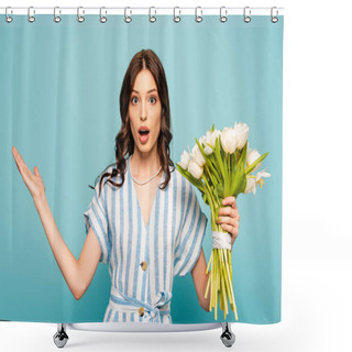 Personality  Shocked Young Woman Holding Bouquet Of Tulips While Standing With Open Arm Isolated On Blue Shower Curtains