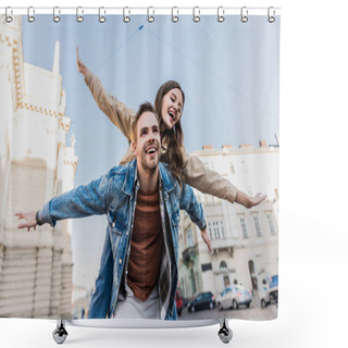 Personality  Low Angle View Of Man Smiling And Piggybacking Excited Girl With Open Arms In City Shower Curtains