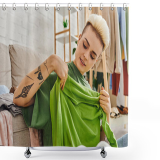 Personality  Pleased Woman Holding Green Garment Near Couch In Living Room While Decluttering Clothing At Home, Trendy Hairstyle, Tattoo, Sustainable Living And Mindful Consumerism Concept Shower Curtains