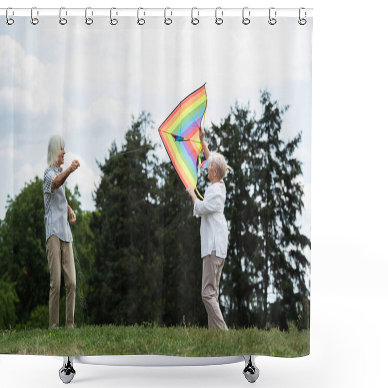 Personality  Senior Woman In Casual Clothes Playing With Kite Near Happy Husband On Green Hill  Shower Curtains