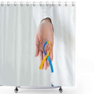 Personality  Female Hand Holding Down Syndrome Day Symbol Blue And Yellow Ribbon Isolated On White Shower Curtains