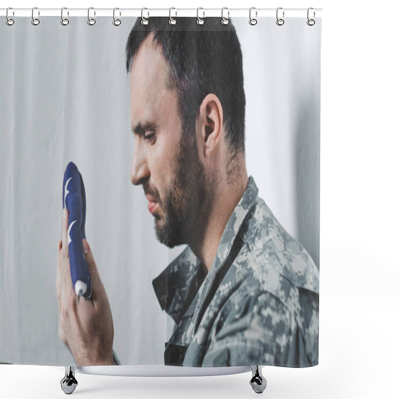 Personality  sad bearded military man looking at usa national flag while standing by white wall shower curtains