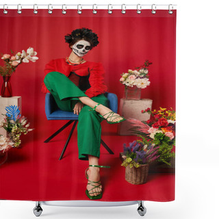 Personality  Woman In Dia De Los Muertos Makeup Sitting In Armchair Near Traditional Altar With Flowers On Red Shower Curtains