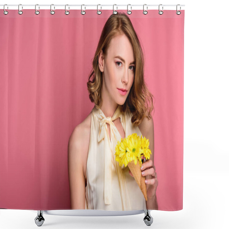Personality  girl holding ice cream cone with yellow flowers and looking at camera isolated on pink shower curtains