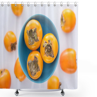 Personality  Selective Focus Of Whole Orange Persimmons On Blue Glass Plate Shower Curtains