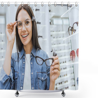 Personality  Portrait Of Attractive Happy Woman Choosing Eyeglasses And Looking At Camera In Ophthalmic Shop Shower Curtains